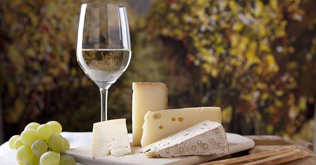 wine and cheese on a table